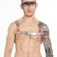 Tattooed Berlin raver with a transparent PVC chest harness