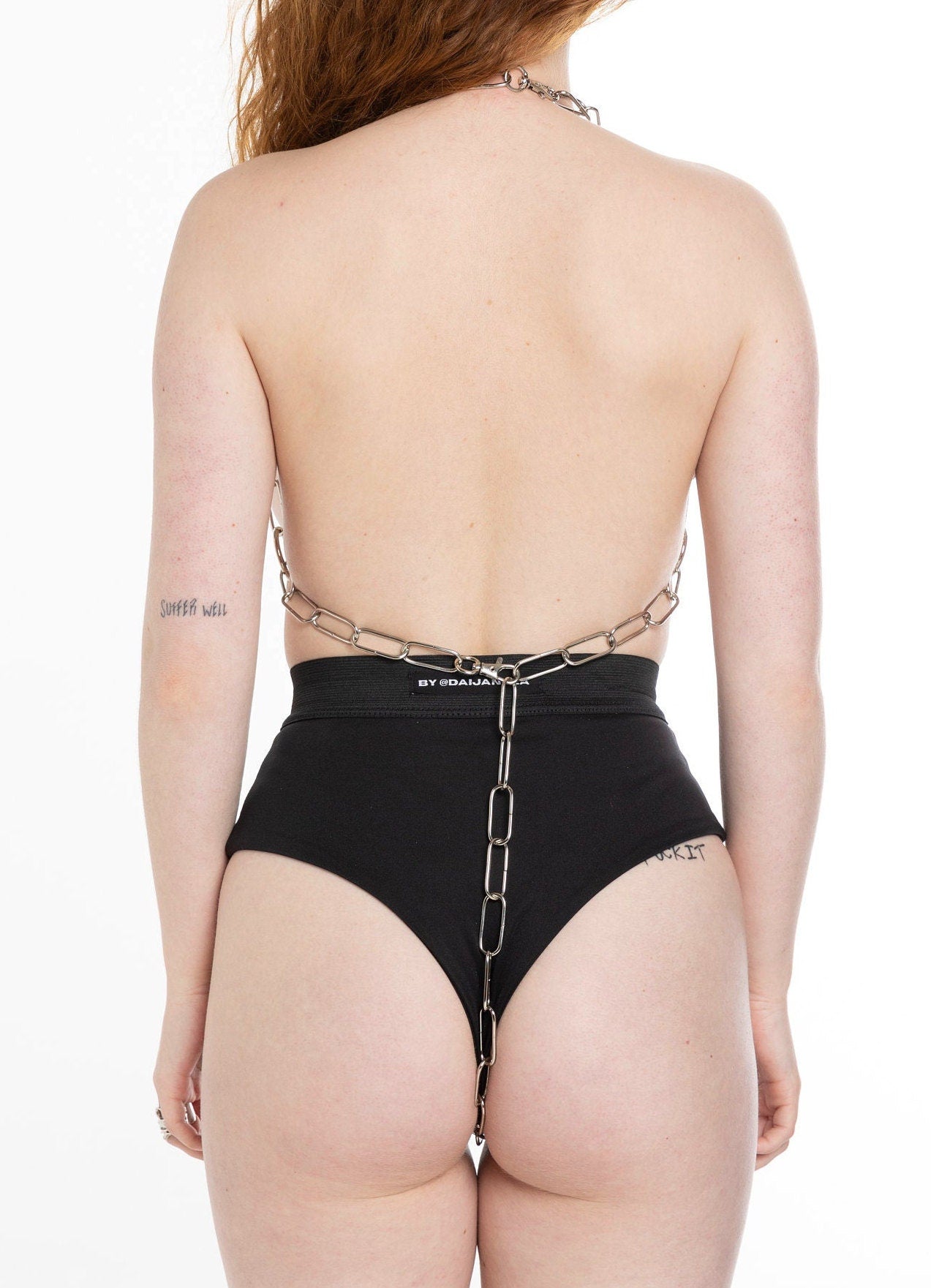 Woman from behind in a chain body